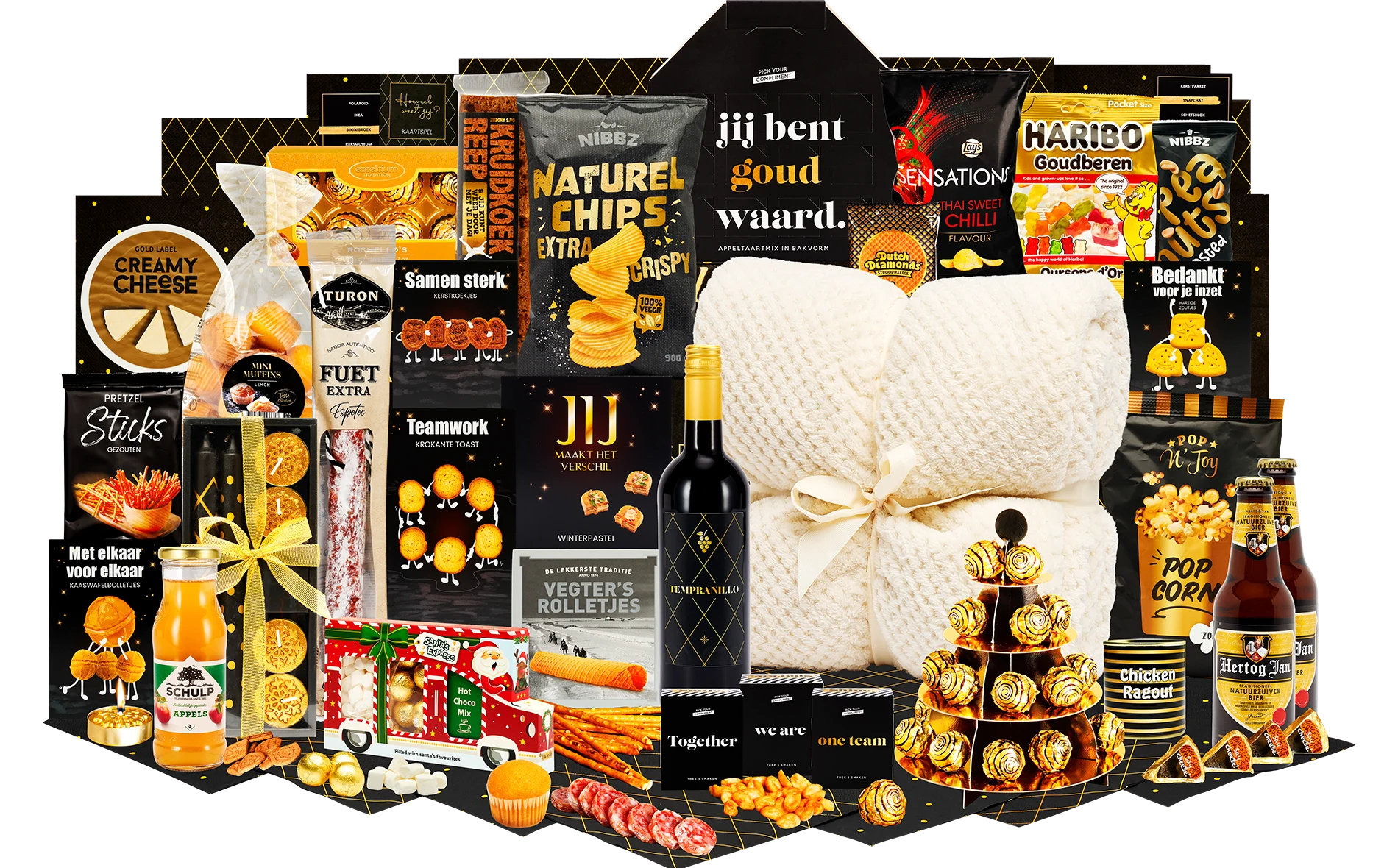 Feestelijk kerstpakket met snacks, dranken, chocolade, deken, gouden accenten.